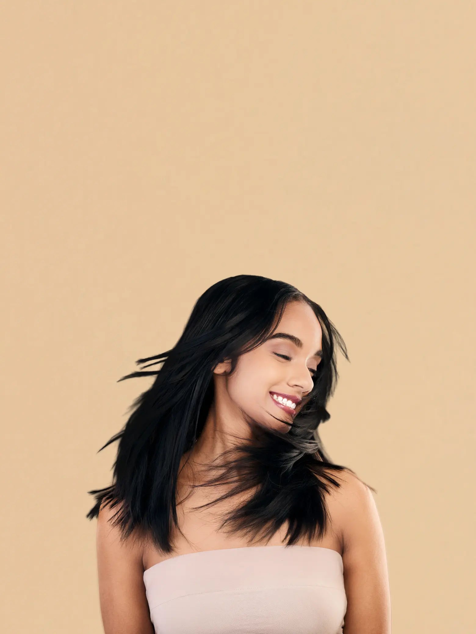 Hair Care Collection featuring Ayurvedic oils and a model applying herbal hair oil