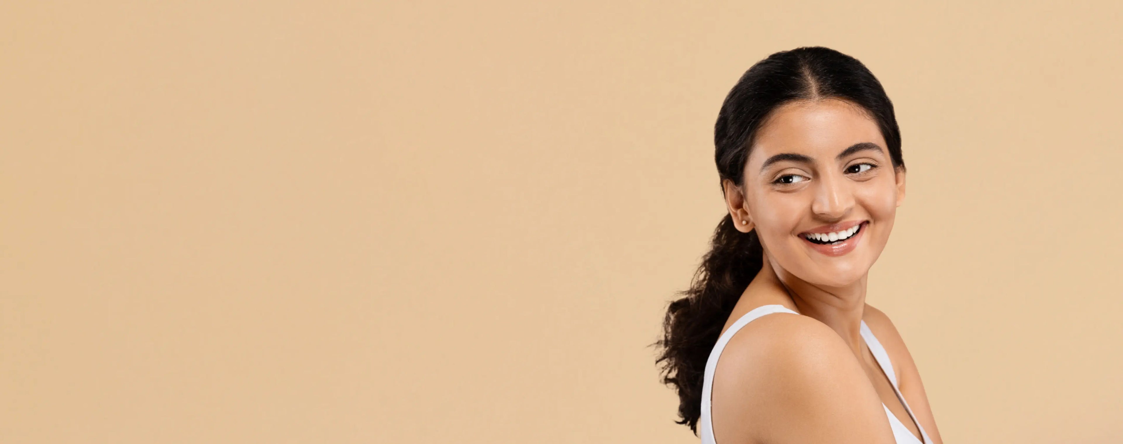 Skin Care Collection with natural face washes and a model demonstrating skin care application