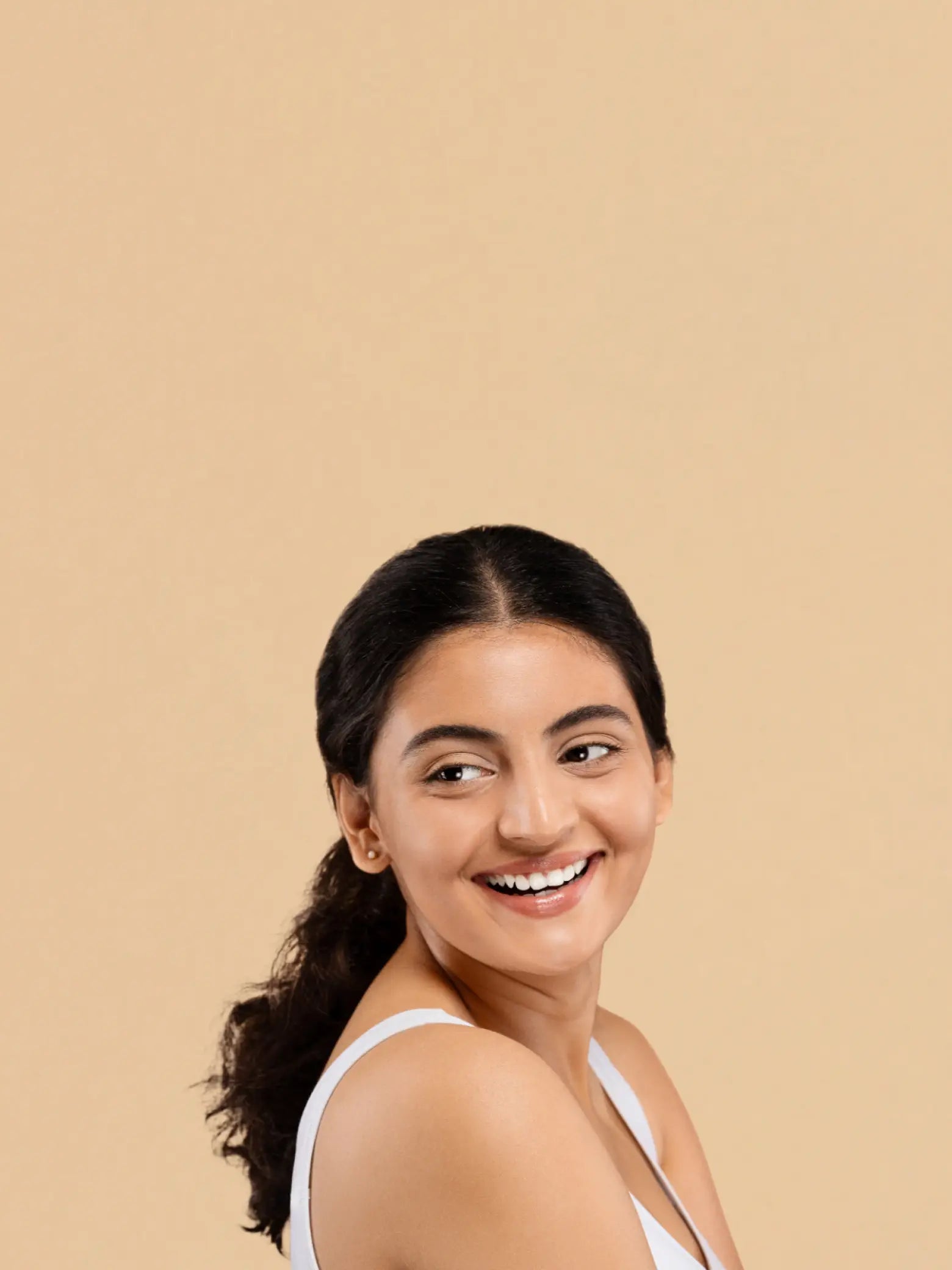 Skin Care Collection with natural face washes and a model demonstrating skin care application